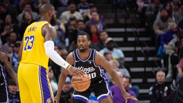 Mar 13, 2024; Sacramento, California, USA; Sacramento Kings forward Harrison Barnes (40) defends against Los Angeles Lakers forward LeBron James (23) during the fourth quarter at Golden 1 Center. Mandatory Credit: Ed Szczepanski-USA TODAY Sports